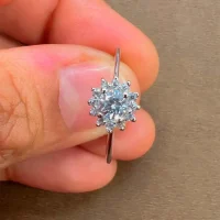 silver ring cluster (gidhe) with 4mm round cubic zirconia displayed on hand