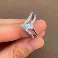 silver ring with cubic zirconia with 4x6 mm pear shaped zirconia displayed on hand