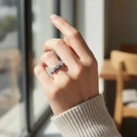 model wearing silver ring with cubic zirconia with 4 mm square shaped zirconia