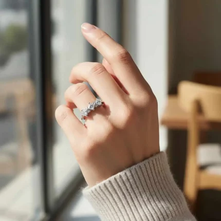 model wearing silver ring with cubic zirconia with 4 mm square shaped zirconia