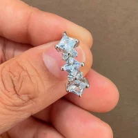 silver ring with cubic zirconia with 4 mm square shaped zirconia displayed on hand