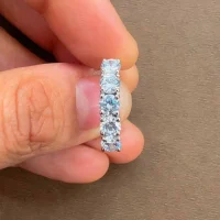 Silver Ring with 4 mm round shaped Cubic Zirconia displayed on hand