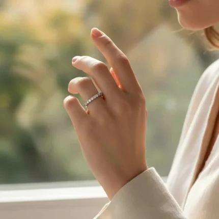 model wearing Silver Ring with small round Cubic Zirconia Half Challa design