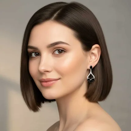 model wearing Silver Earrings with 5x7 mm oval shaped Black Onyx Gemstone and Cubic Zirconia