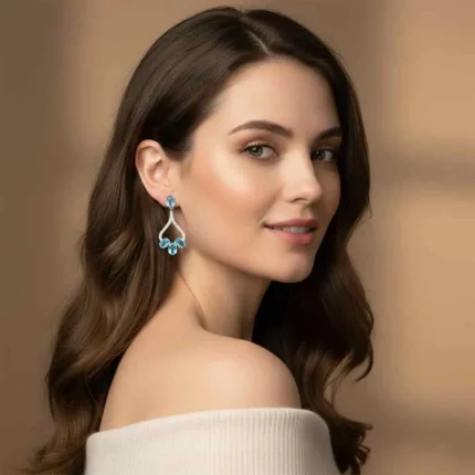 model wearing 5x7 mm oval shaped Blue Topaz Gemstone and Cubic Zirconia