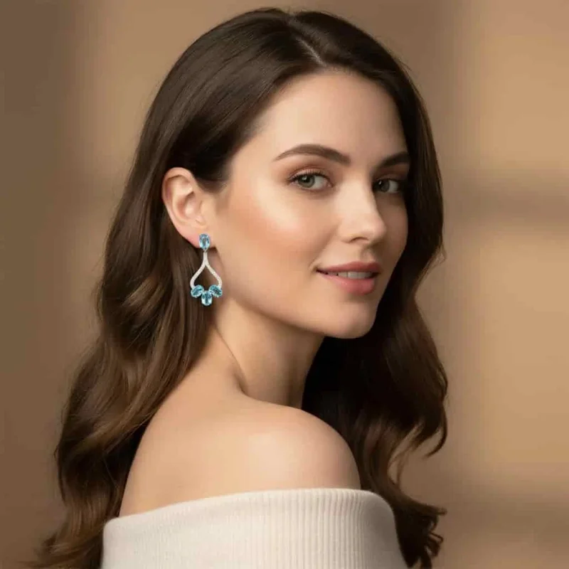 model wearing 5x7 mm oval shaped Blue Topaz Gemstone and Cubic Zirconia