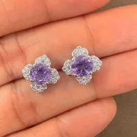 Silver Studs flower shaped with 6mm round shaped Brazilian Amethyst Gemstone and Cubic Zirconia displayed on hand