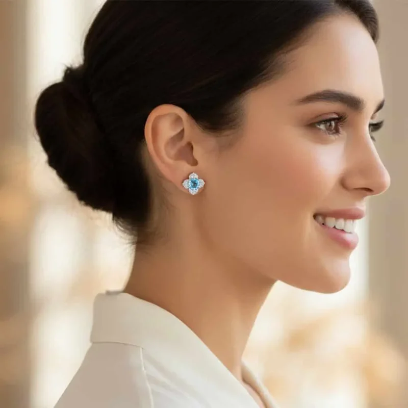 model wearing Silver Studs flower shaped with 6mm round shaped Blue Topaz Gemstone and Cubic Zirconia