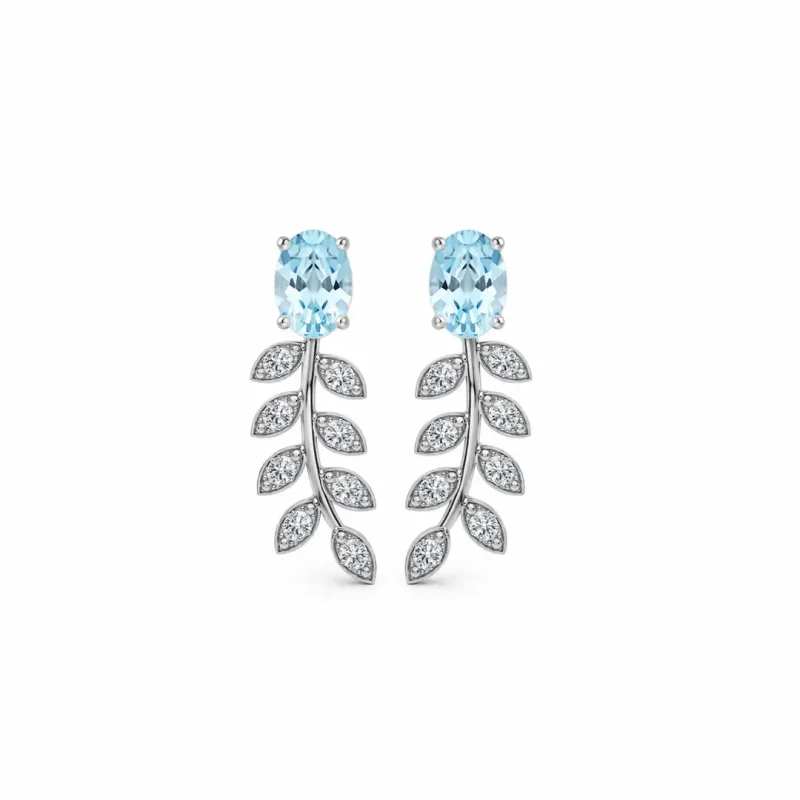 silver earrings gemstones with 5x7 mm oval blue topaz