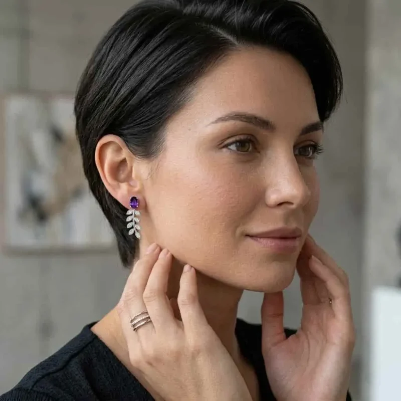 model wearing silver earrings gemstones with 5x7 mm oval amethyst