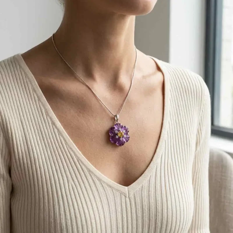 model wearing silver pendant with carved flower amethyst gemstone with citrine and cubic zirconia