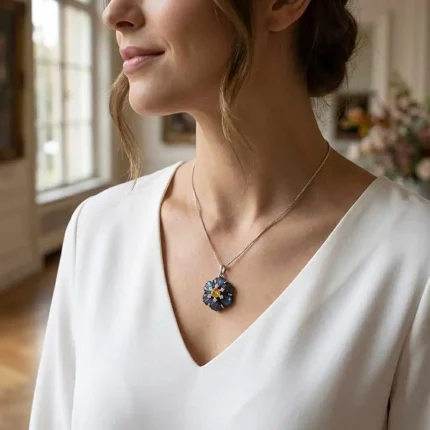 model wearing silver pendant with carved flower labradorite gemstone with citrine and cubic zirconia